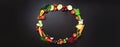 Healthy food background. Circle of organic vegetables, fruits, nuts, berries with copy space on black chalkboard. Top Royalty Free Stock Photo