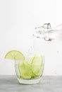 Healthy food background: cucmber and lime detox soda water. Vegetarian food concept