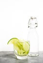 Healthy food background: cucmber and lime detox soda water. Vegetarian food concept Royalty Free Stock Photo