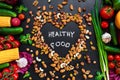 Healthy food background. Healthy food concept with fresh vegetables for cooking and some kind types of nuts.