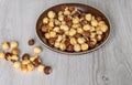 Healthy food for background image close up hazelnuts. Nuts texture on top view on the cup plate