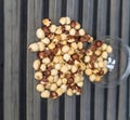 Healthy food for background image close up hazelnuts. Nuts texture on top view on the cup plate