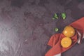 Healthy food background with persimmon and doucette lambs-lettuce, cornsalad, field salad with napkin on a red background, top Royalty Free Stock Photo