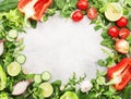 Healthy food background with various green herbs and vred vegetables. Ingredients for cooking salad. Top view, copy space Royalty Free Stock Photo