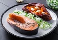 Healthy food: baked salmon and sweet potato and vegetables. Royalty Free Stock Photo