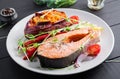 Healthy food: baked salmon and sweet potato and vegetables. Royalty Free Stock Photo