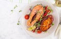 Healthy food: baked salmon and sweet potato and vegetables. Royalty Free Stock Photo