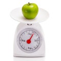 Healthy food on balance scale Royalty Free Stock Photo