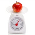 Healthy food on balance scale Royalty Free Stock Photo