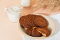 Healthy food, breakfast, cereal snack. Fresh milk in a glass jug and oatmeal cookies on the table, an armful of ears of corn on a Royalty Free Stock Photo