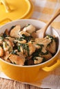 Healthy food: Chicken pieces braised with spinach in a pan close Royalty Free Stock Photo