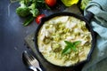 Healthy food: Chicken Stew with Broccoli and Sour Cream on a stone or slate background. Diet menu.