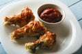 Healthy food from chicken wings with homemade tomato paste on wooden table. Top view. Copy space Royalty Free Stock Photo