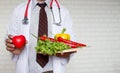 Healthy food and clean concept, hands doctor with vegetables Royalty Free Stock Photo