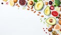 Healthy food clean eating selection. Avocado, pomegranate seeds, nuts, fruits and vegetables on white background