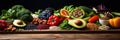 Healthy food clean eating selection: fruit, vegetable, seeds, superfood, cereal, leaf vegetable on gray concrete background