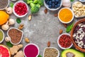 Healthy food clean eating selection: fruit, vegetable, seeds, superfood, nuts, berries on concrete background. top view Royalty Free Stock Photo