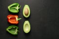 Healthy food clean eating selection on gray background. Green and red bell pepper, avocado. Top view. Place the text Royalty Free Stock Photo