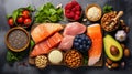 Healthy food clean eating selection: salmon, salmon, tuna, avocado, spinach, chickpeas, nuts, seeds.
