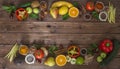 Healthy food, clean food selection: fruits, vegetables, seeds, spices on brown boards with free space in the middle for text