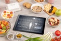 Healthy food composition with tablet Royalty Free Stock Photo
