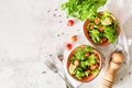 Bowls of vegetable mixed salad top view flat lay