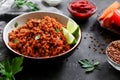 Healthy food concept. Buckwheat porridge with tomato sauce. Dark background. Copy space. Diet lunch. Ingredients.