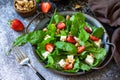 Healthy food concept, Diet salad plate. Summer salad with strawberries, fetacheese and walnut Royalty Free Stock Photo