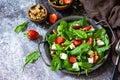 Healthy food concept, Diet salad plate. Summer salad with strawberries, fetacheese and walnut Royalty Free Stock Photo