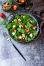 Healthy food concept, Diet salad plate. Summer salad with strawberries, fetacheese and walnut Royalty Free Stock Photo