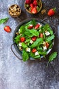 Healthy food concept, Diet salad plate. Summer salad with strawberries, fetacheese and walnut Royalty Free Stock Photo