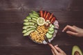 Healthy food concept. Eating healthy salad with chickpea and vegetables on the wooden table. Vegan food. Vegetarian diet Royalty Free Stock Photo