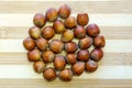 Flat lay, close-up of hazelnuts on a bamboo board. Macro, selective focus, horizontal photo. Kyiv, Kiev,