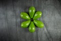 Healthy food concept. Fresh organic avocado. Avocado on dark wooden table, top view, copy space. Royalty Free Stock Photo