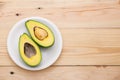 Healthy food concept. Fresh organic avocado on table Royalty Free Stock Photo