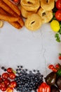 Healthy food concept. Fruits, bagels and sausage on white table