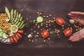 Healthy food concept. Hands and healthy salad with chickpea and vegetables on wooden table. Vegan food. Vegetarian diet Royalty Free Stock Photo