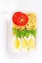 Healthy food concept: lunch box filled with bulgur, vegetables, boiled egg and parsley, top view Royalty Free Stock Photo