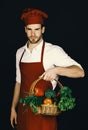 Healthy food concept. Man with beard on black background.