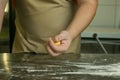 The process of making natural egg noodles. The chef`s hands are kneading the dough Royalty Free Stock Photo