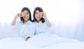 Healthy food concept. two young woman holding fresh oranges fruit covered their one eyes. Cheerful two friend or sister Royalty Free Stock Photo