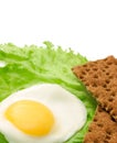 Healthy food copy space: fried eggs, lettuce, crisp bread Royalty Free Stock Photo