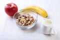 Healthy food with Corn Flakes cereal in a bowl, apple, banana and glass with milk. Morning breakfast. Royalty Free Stock Photo