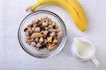 Healthy food with Corn Flakes cereal in a bowl, apple, banana and glass with milk. Morning breakfast. Top view. Royalty Free Stock Photo