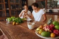 Healthy Food. Couple Cooking Vegetable Salad And Drinking Water At Kitchen In Tropical Villa. Woman And Man Preparing.