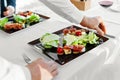 Healthy Food. Couple Eating Caesar Salad For Meal In Restaurant. Royalty Free Stock Photo