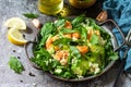 Healthy food. Couscous salad with arugula, avocado and grilled shrimps Royalty Free Stock Photo