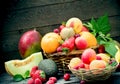 Healthy food, different organic fruits, fresh fruit in wicker basket - vegetarian food Royalty Free Stock Photo