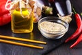 Healthy food and drink concept. Sesame oil and seeds on a chines Royalty Free Stock Photo