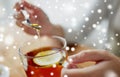 Close up of woman adding honey to tea with lemon Royalty Free Stock Photo